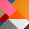 Close up detail of a modern geometric painting with bold angled shapes in pink, blue, white, orange and grey, showing visible paint texture and brush strokes.