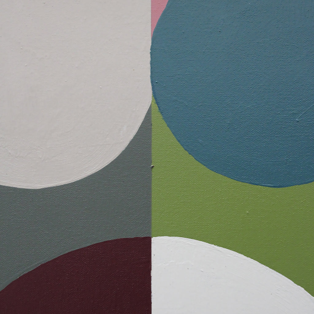 Abstract geometric wall art featuring bold painted circles and arcs in muted tones of blue, green, white, gray, burgundy, and a small pink section.