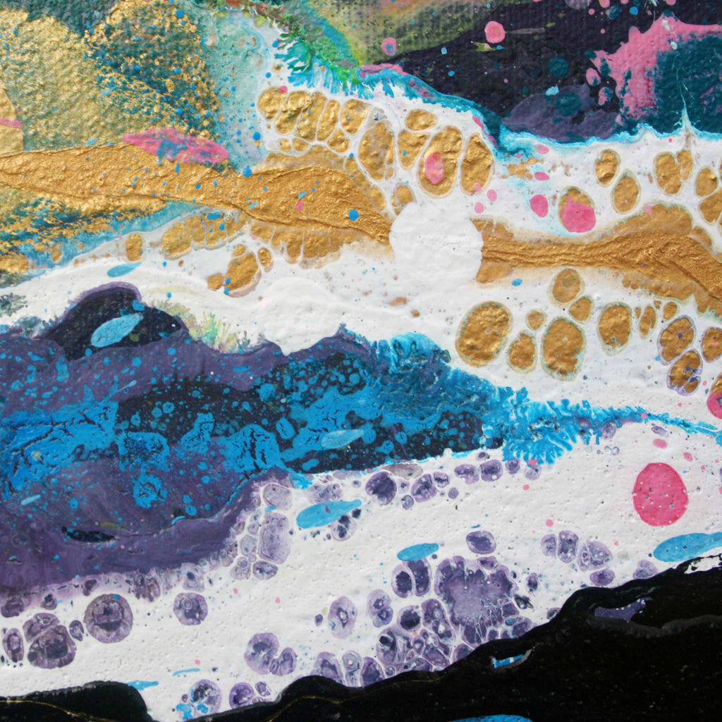 Close Up detail of abstract acrylic painting Malva wave with fluid textured splashes of gold, blue, purple, pink, black, and white on a textured canvas.