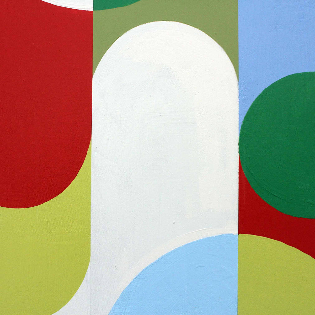 Close up detail of abstract geometric wall art featuring bold curved and circular shapes in red, green, light blue, olive green, yellow-green, and white.