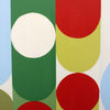 Abstract geometric wall art featuring bold overlapping circles and arcs in green, red, yellow, white, and light blue on a white background.