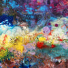 An abstract painting with thick, textured impasto brushstrokes and splatters in a rich mix of colors including blue, purple, red, yellow, pink, and white.