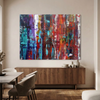 Fracture - A large abstract canvas wall art painting featuring vibrant vertical brushstrokes of red, blue, purple, white, and orange, displayed in a modern dining room setting above a wooden credenza.