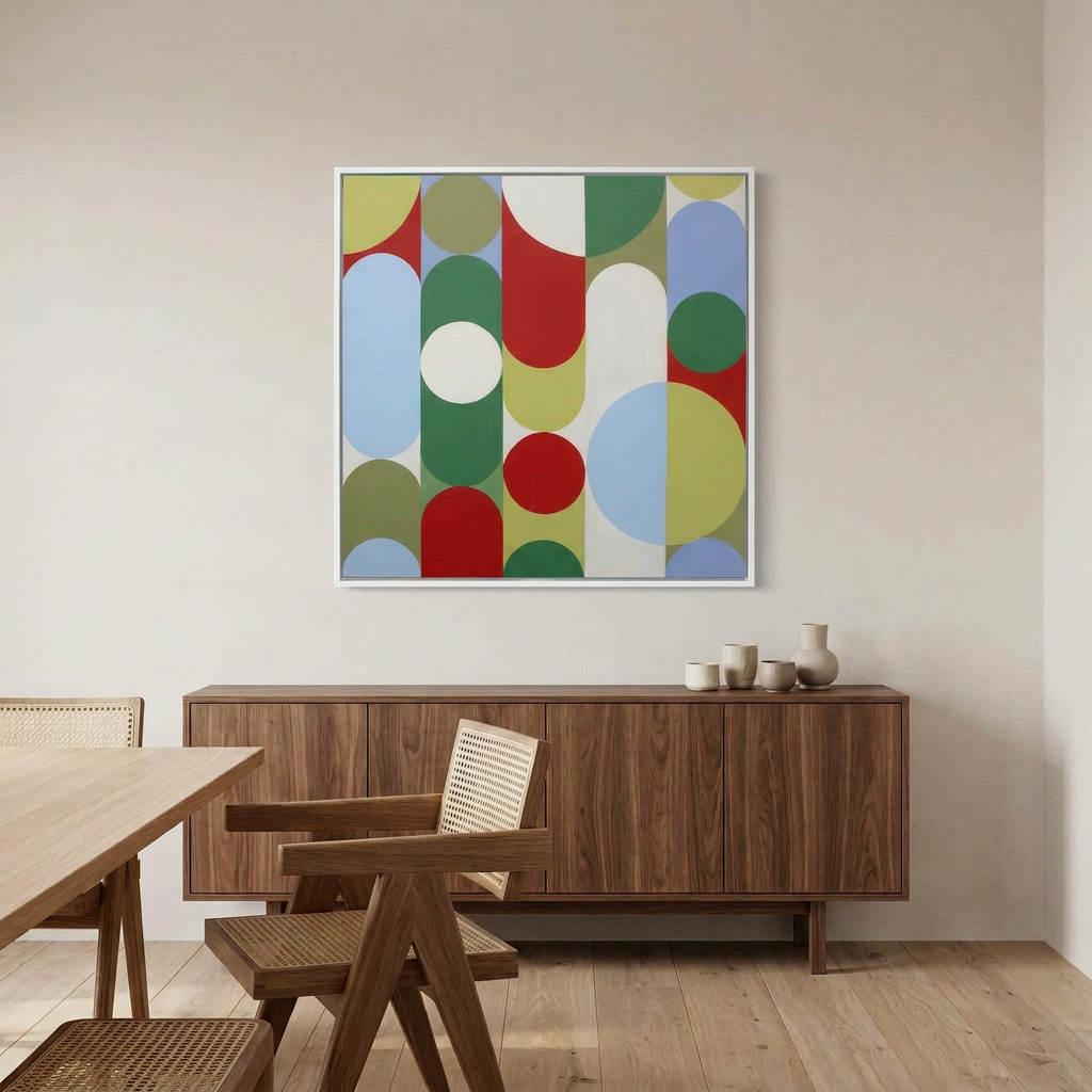 Geo Pop Lines No 2 - A square framed abstract wall art painting with overlapping circles and arcs in red, green, blue, yellow, and white, displayed above a wooden sideboard in a modern dining room setting.