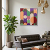 Geo Pop Lines 9 - A square framed wall art painting with an abstract geometric pattern of overlapping circles and arcs in multiple colours, hanging on a light grey wall above a dark grey sofa in a modern living room setting.