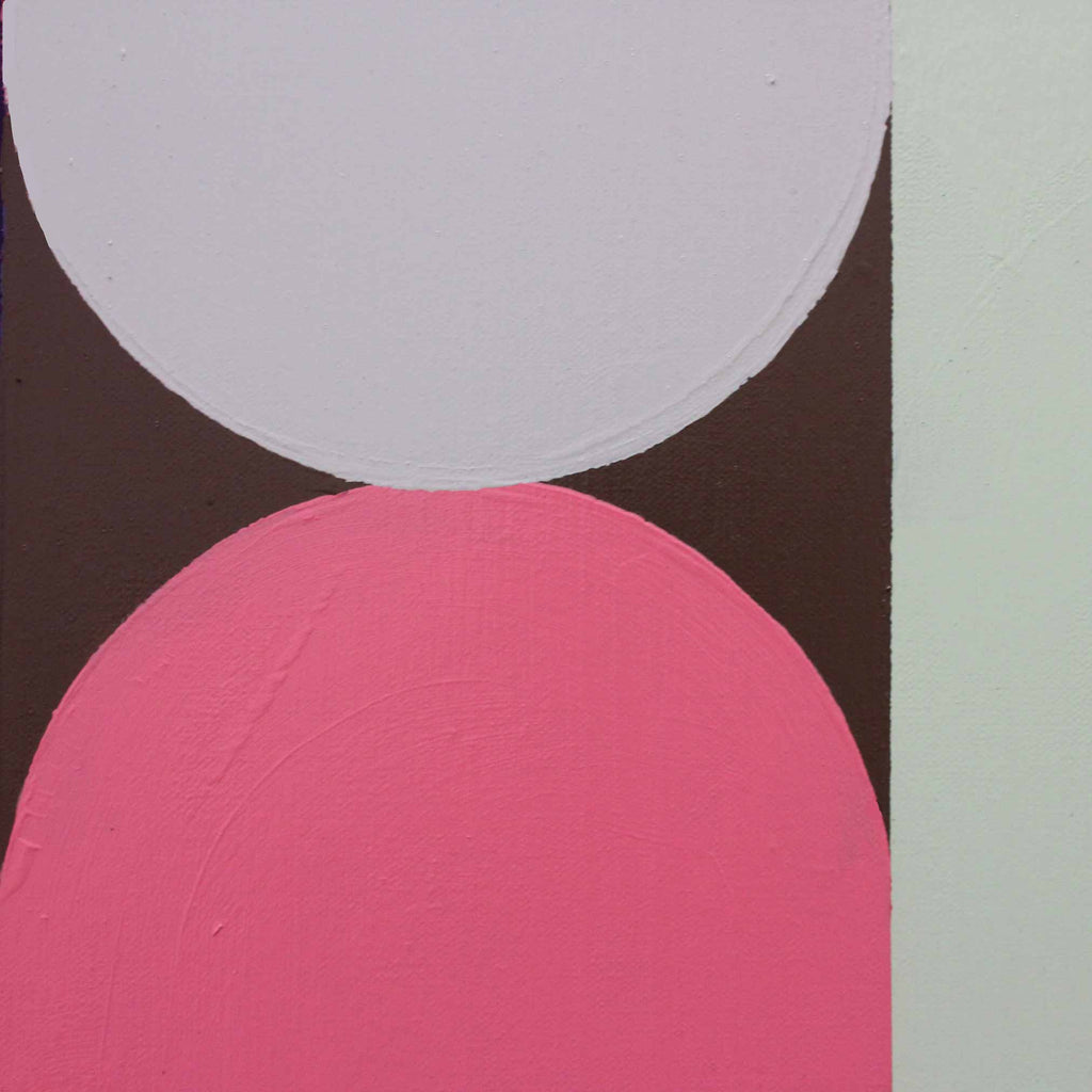 Abstract geometric wall art featuring a large white semicircle and a large pink semicircle on a dark brown background, with a pale mint vertical stripe on the right side.