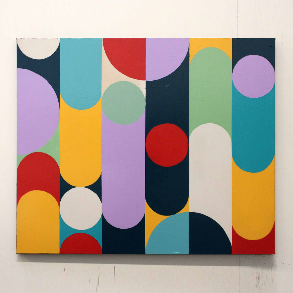 A abstract canvas painting featuring vertical bands of yellow, teal, purple, red, white, and dark blue shapes, hung on a white wall.