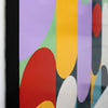 Close-up of a colorful abstract artwork with overlapping organic shapes in purple, green, yellow, red, white, and dark gray, bordered by a black frame.