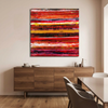 Indian Summer  - Abstract canvas wall art painting with bold horizontal brushstrokes in red, orange, yellow, and black, displayed above a wooden sideboard in a modern dining room setting.