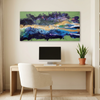 Malva Wave is a abstract landscape painting with vibrant greens, blues, purples, and gold brushstrokes, displayed on a beige wall above a light wood desk with a computer monitor and a potted plant.