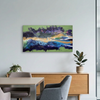 Malva Wave A large abstract landscape canvas painting with vibrant green, blue, purple, and gold brushstrokes, displayed on a white wall in a modern dining room setting above a wooden sideboard.