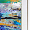 Close-up of an abstract canvas painting Ocean mist by Andy Watt with textured impasto brushstrokes in blue, teal, white, gold, purple, and black, shown with a white frame edge on a light wall.