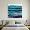 Oceanic - An abstract canvas painting with horizontal layers of teal, blue, and purple tones, displayed on a cream bedroom wall above a double bed.
