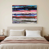 Pink Fathoms - An abstract canvas wall art painting with horizontal brushstrokes of blue, pink, red, black, and white, displayed above a neatly made bed in a modern bedroom setting.