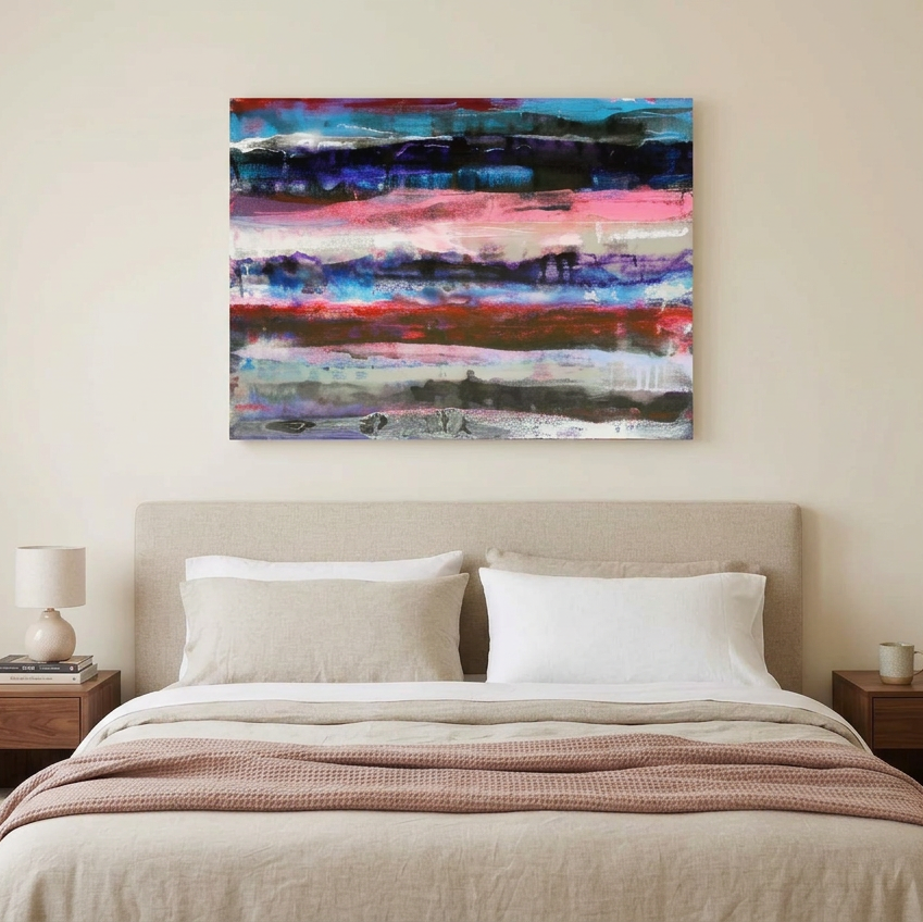 Pink Fathoms - An abstract canvas wall art painting with horizontal brushstrokes of blue, pink, red, black, and white, displayed above a neatly made bed in a modern bedroom setting.