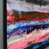 Close up detail of abstract canvas wall art featuring expressive horizontal brushstrokes in red, pink, blue, black, white, and grey, shown hanging against a light grey wall.