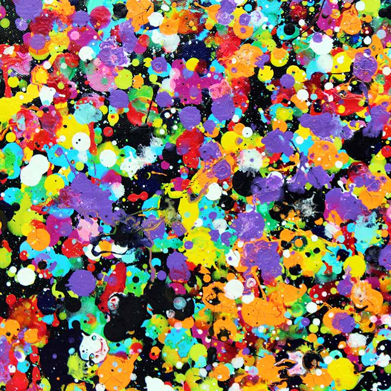Rainbow showers  Close up detail of a dense abstract paint splatter pattern with many bright colours including yellow, orange, purple, pink, blue, green, red, black, and white, covering the full frame.