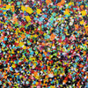 Rainbow Showers - A vibrant abstract paint splatter pattern featuring a dense, multi-coloured array of splashes and dots on a black background.