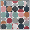 An abstract geometric painting featuring a grid of painted circles and half-circles in muted pink, teal, red, orange, gray, black, and navy on a white background.